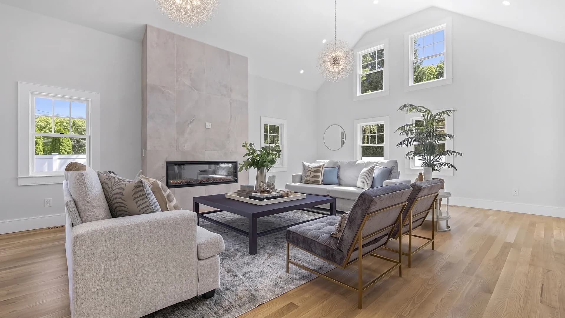 Living room with tiled fireplace wall